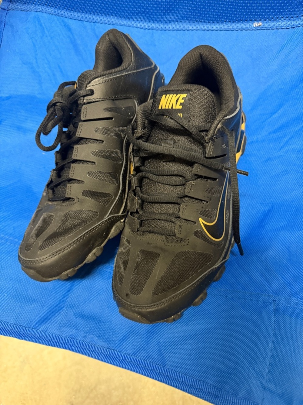 Nike Black Sneakers with Yellow Swoosh Accents